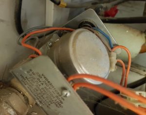 Motorised valve with shield removed showing synchro motor