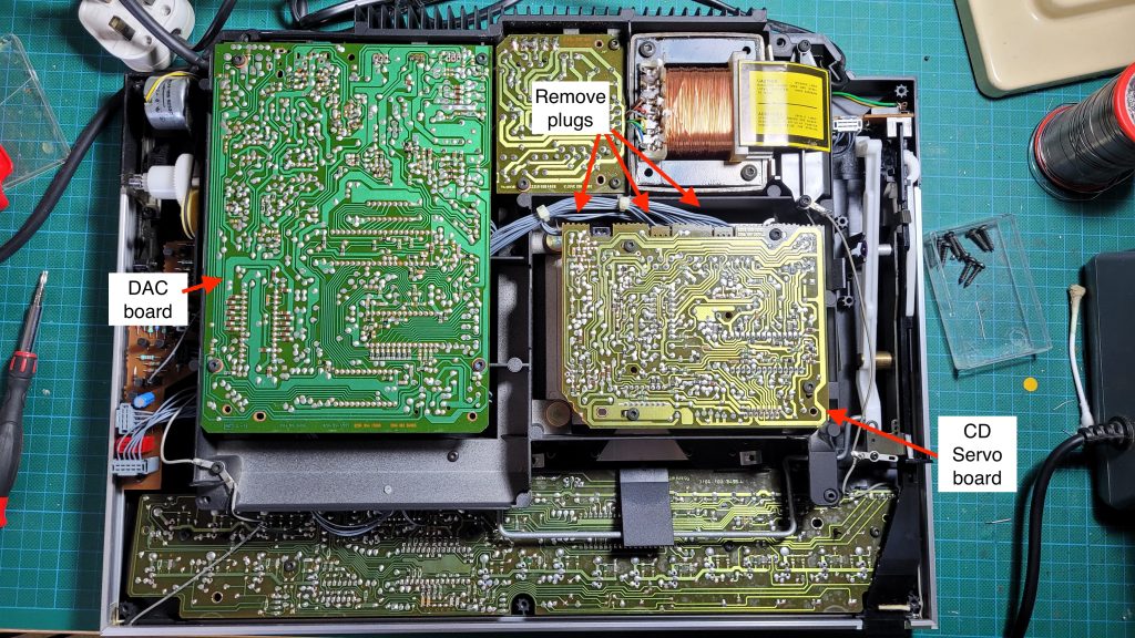 Internal PCB layout showing position of the CD servo board below the mains transformer.